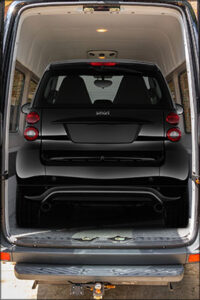 Smart Car Inside Van In Black